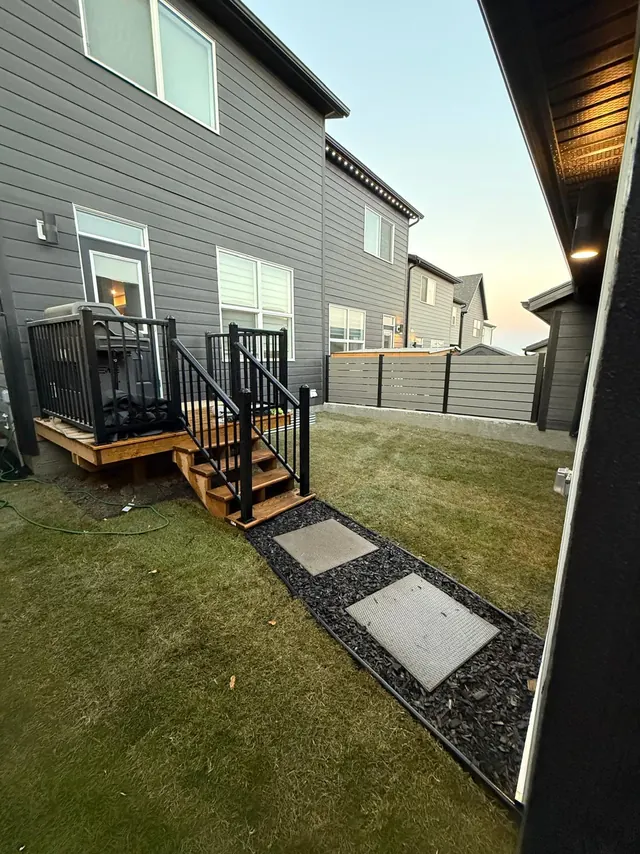 Deck stairs leading onto slab stepping stones