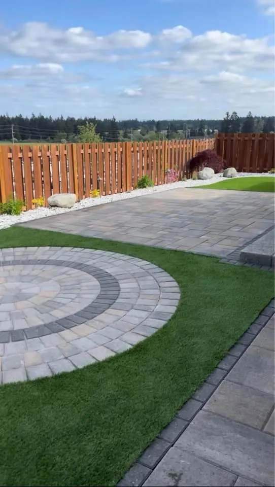 Circular paver feature set into a turf lawn