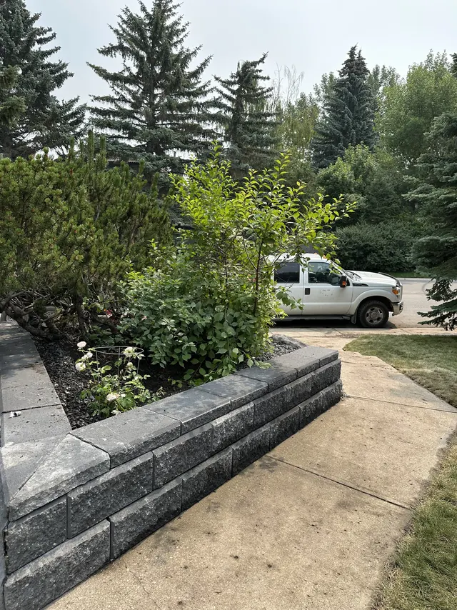 Block wall meeting the driveway